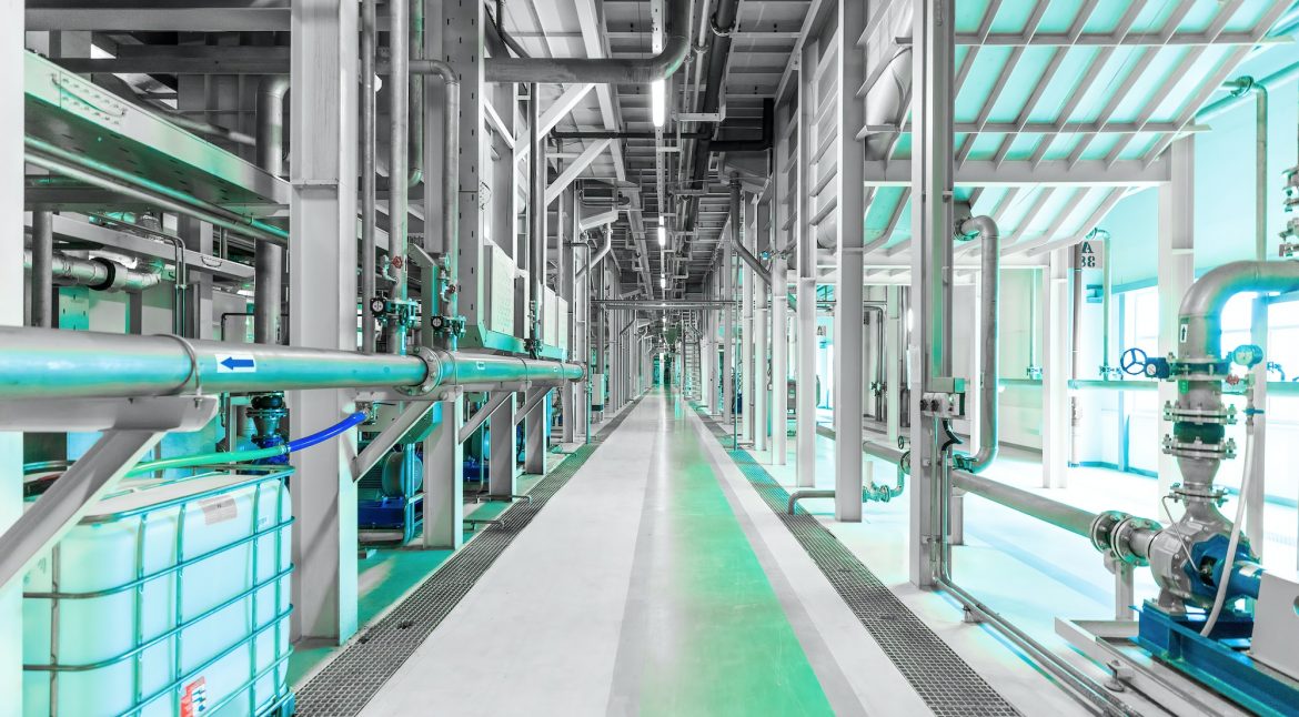 Photo of plant interior, modern enterprise, pumping station. Green tone