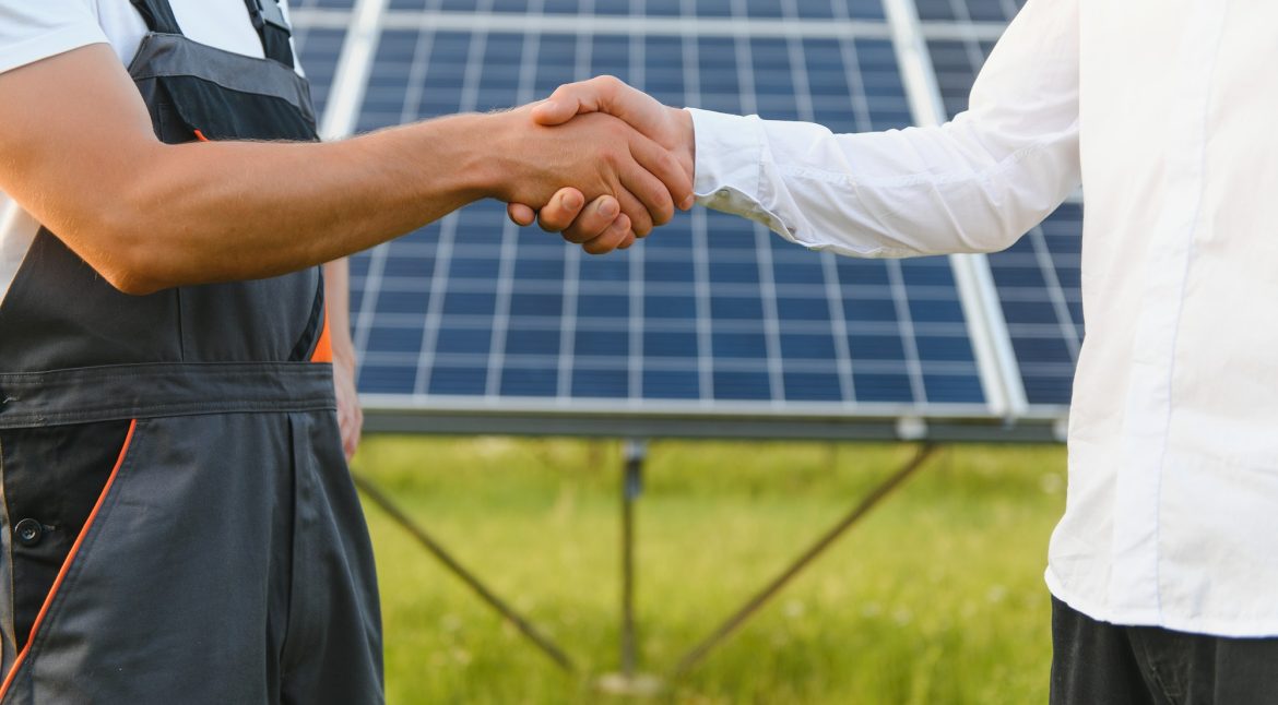 Shaking hands of engineers after the conclusion of the agreement in the renewable energy